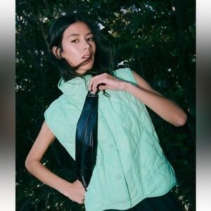 Free people movement Slim fold runner bag in the color oil slick NWT